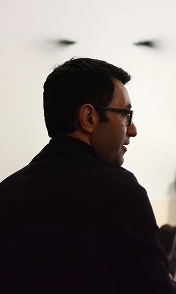 Photo portrait of Michael Marder from behind looking off to the right.