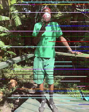 Glitched photo of black man in grean shirt and shorts.